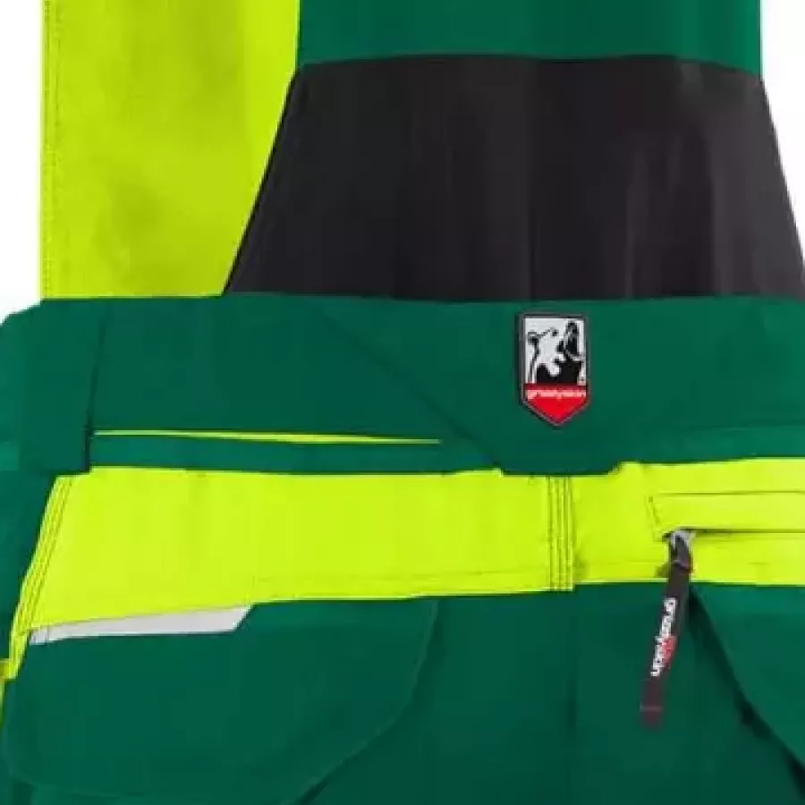 **Elastischer Stretch-Einsatz** ermöglicht natürliche Bewegungsfreiheit für ganztägigen Tragekomfort in aktiven Arbeitspositionen.