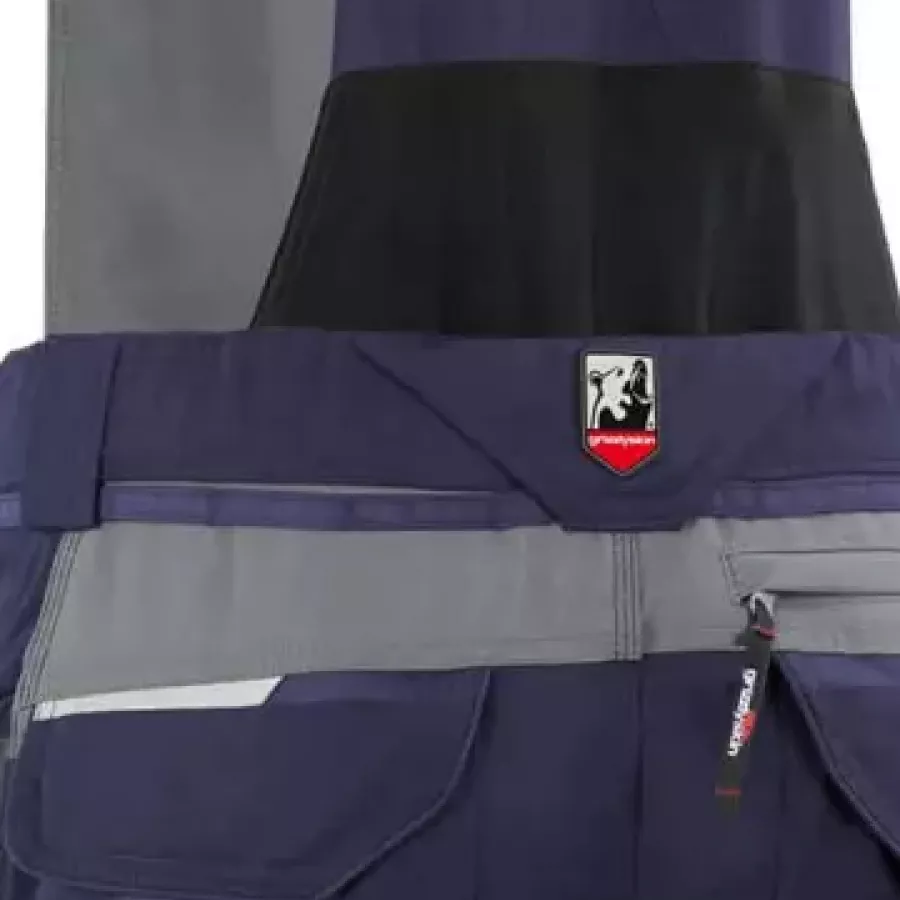 **Elastischer Stretch-Einsatz** ermöglicht natürliche Bewegungsfreiheit für ganztägigen Tragekomfort in aktiven Arbeitspositionen.