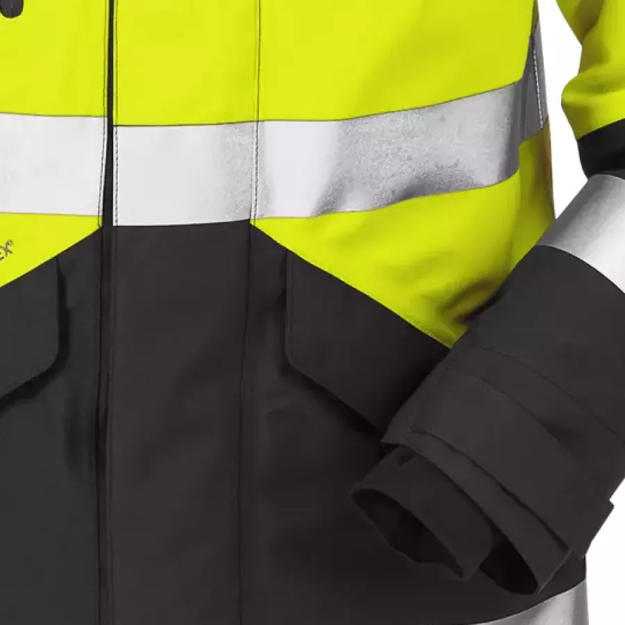 **Mit Klettverschluss verstellbare Ärmel mit Daumenschlaufe** bieten eine sichere, individuelle Passform, die bei aktiver Arbeit nicht verrutscht.