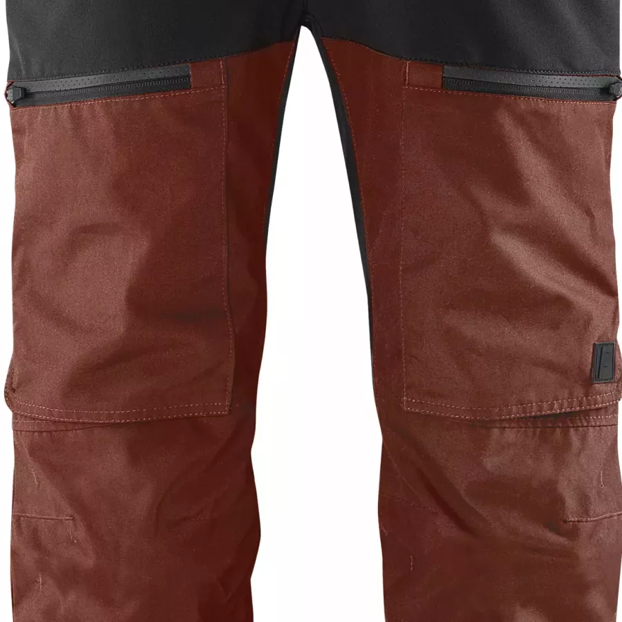 **Thigh Pockets** provide easy access to tools and essentials right at your side.