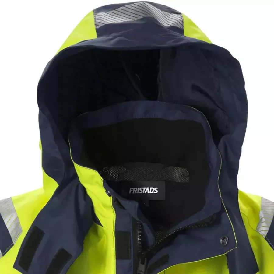 Die abnehmbare Kapuze ermöglicht eine einfache Anpassung an wechselnde Wetter- und Arbeitsbedingungen.