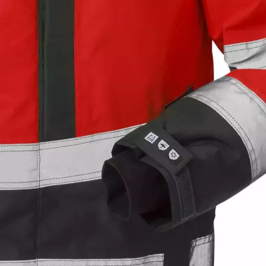 **Per Klettverschluss verstellbare Ärmel mit Daumenloch** sorgen für einen sicheren, bequemen Sitz, der bei aktiver Arbeit nicht verrutscht.