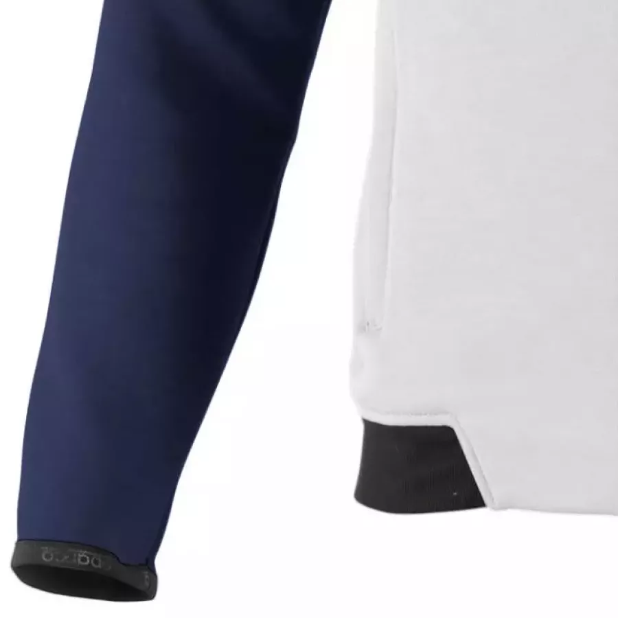 **Elastische Bündchen** sorgen für einen festen und sicheren Sitz der Ärmel, sodass Sie sich frei und ohne Ablenkungen bewegen können.