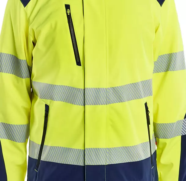 Multiple secure storage options include a **zipped chest pocket with an integrated D-ring** for tools, and **front pockets with zippers**. A convenient **Napoleon pocket** is placed inside the wind flap for quick, protected access to essentials, ensuring your items are safe and dry across various tasks.