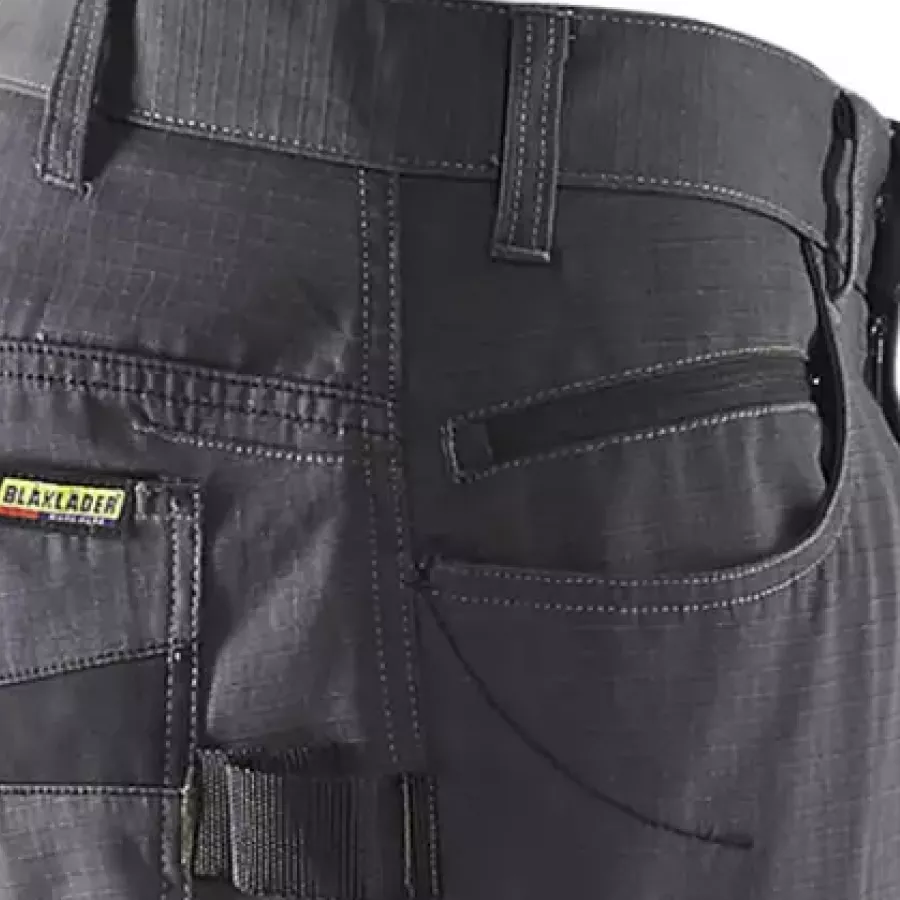 **Zipper Pocket** keeps your essentials secure and easy to reach while you work.