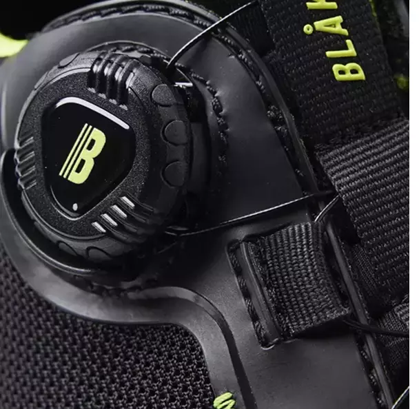 Experience a secure and comfortable fit with the **Freelock closure system** on the side of the shoe, which enables quick and easy on and off. This mechanism provides a consistent and snug fit while eliminating the hassle of traditional laces. The system's design also ensures a clean, streamlined profile, reducing snag hazards.