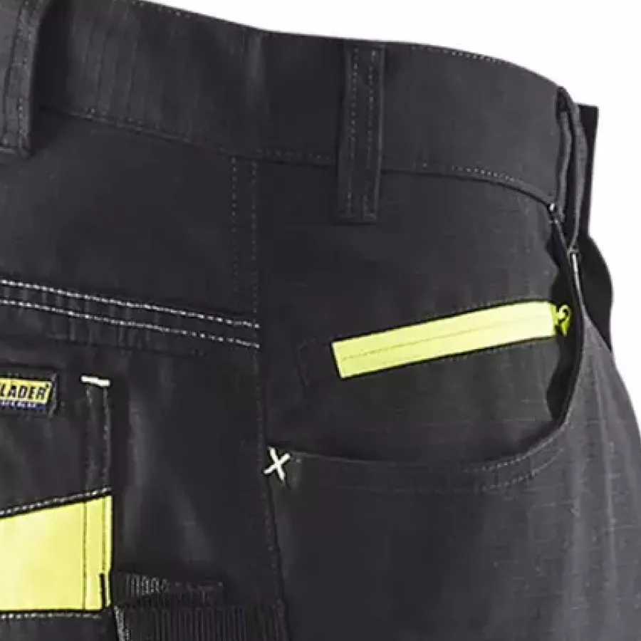 **Zipper Pocket** keeps your essentials secure and easy to reach while you work.