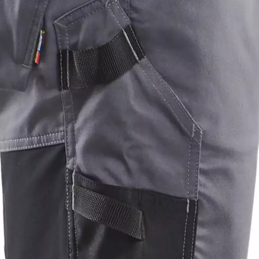 **Reinforced Ruler Pocket with Knife Holder** offers dependable strength for carrying precise tools safely.