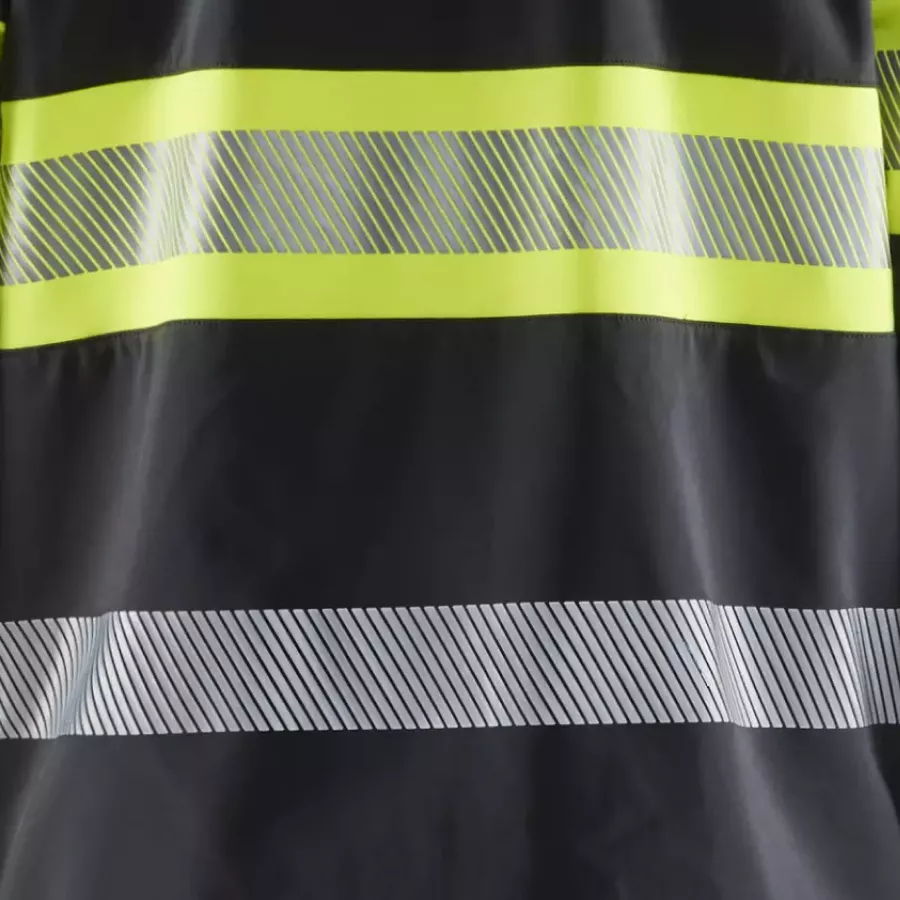 **Segmented Reflective Strips** boost visibility while keeping the jacket flexible and comfortable.