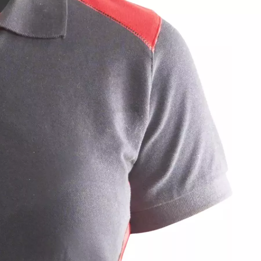 **Short Sleeves with Ribbed Cuffs** offer easy movement while maintaining a neat, structured finish.