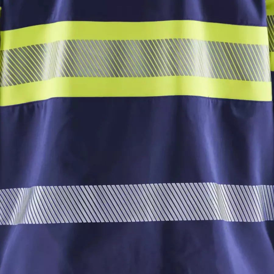 **Segmented Reflective Strips** boost visibility while keeping the jacket flexible and comfortable.