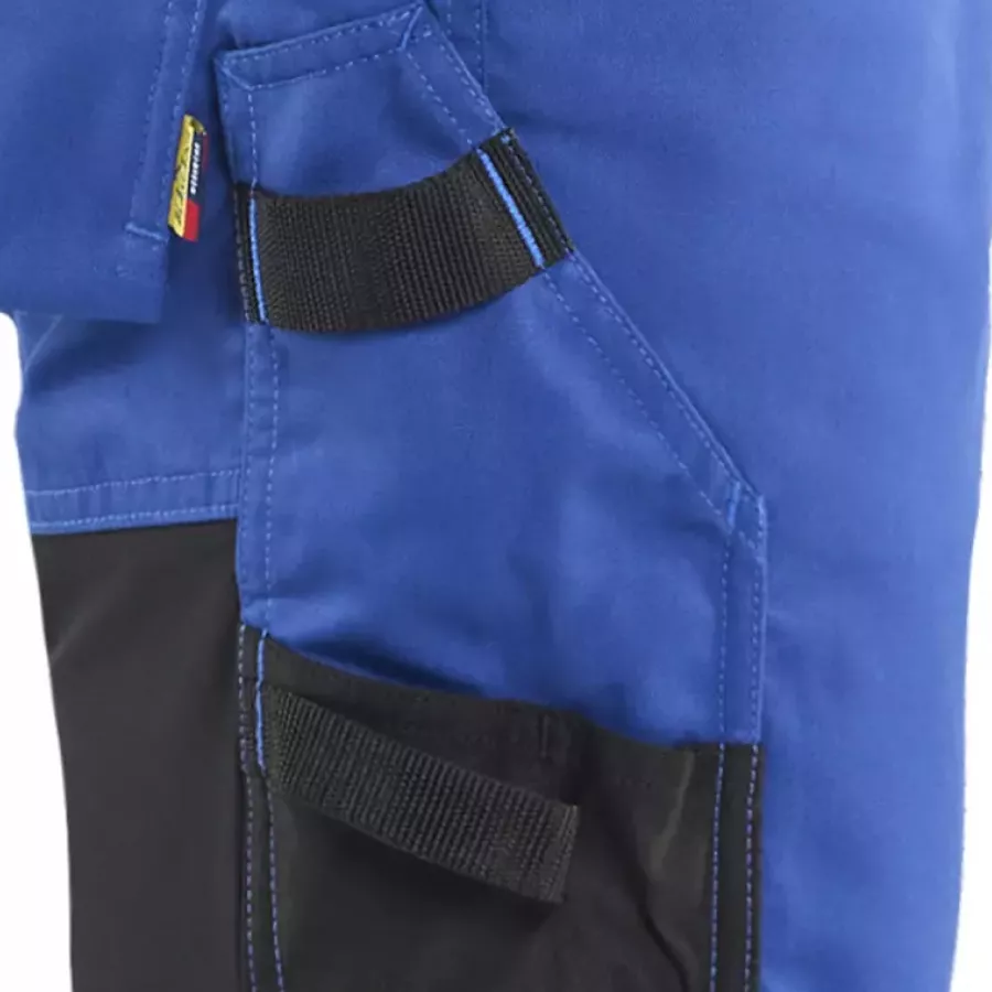**Reinforced Ruler Pocket with Knife Holder** offers dependable strength for carrying precise tools safely.