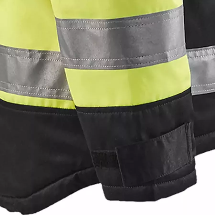 **Verstellbare Ärmelbündchen mit Klettverschluss** ermöglichen eine sichere, individuelle Passform, um kalte Luft draußen zu halten.