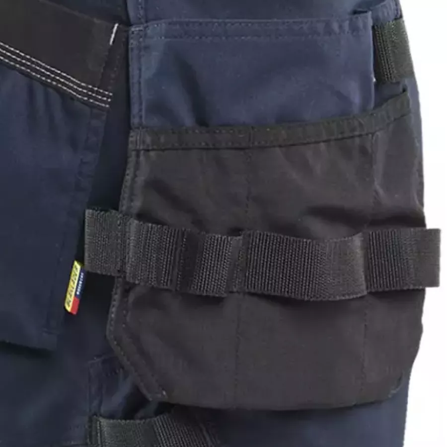 **Holster Pockets** keep your essentials close at hand so you can move freely without breaking your flow.