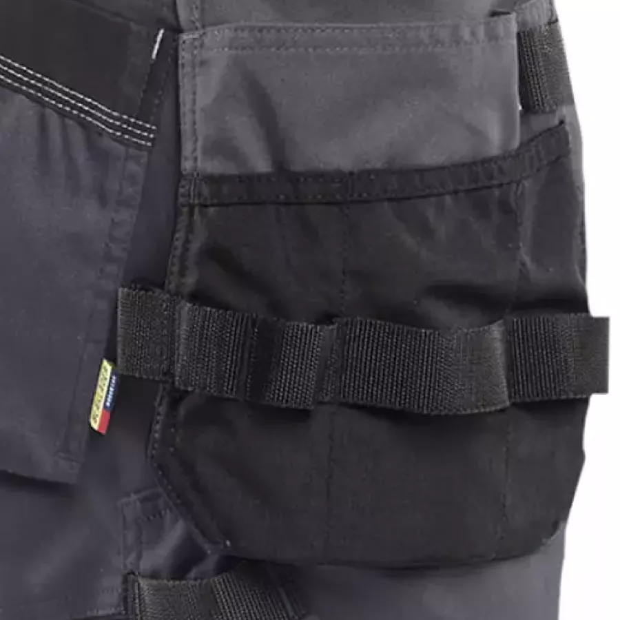 **Holster Pockets** keep your essentials close at hand so you can move freely without breaking your flow.