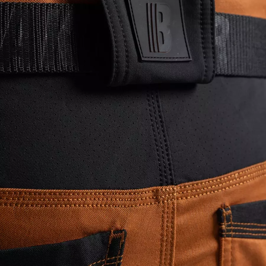 **Stretch Sections** allow effortless mobility that keeps you working freely in every position.