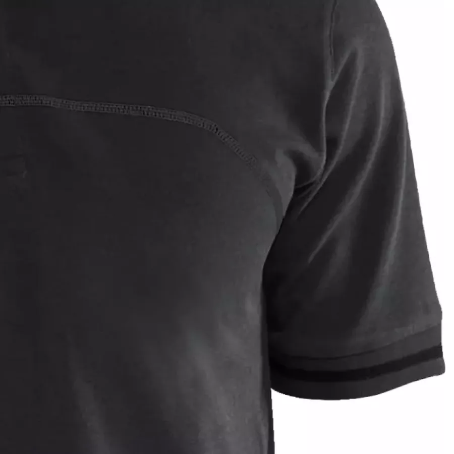 **Short Sleeves with Ribbed Cuffs** offer easy movement while maintaining a neat, structured finish.