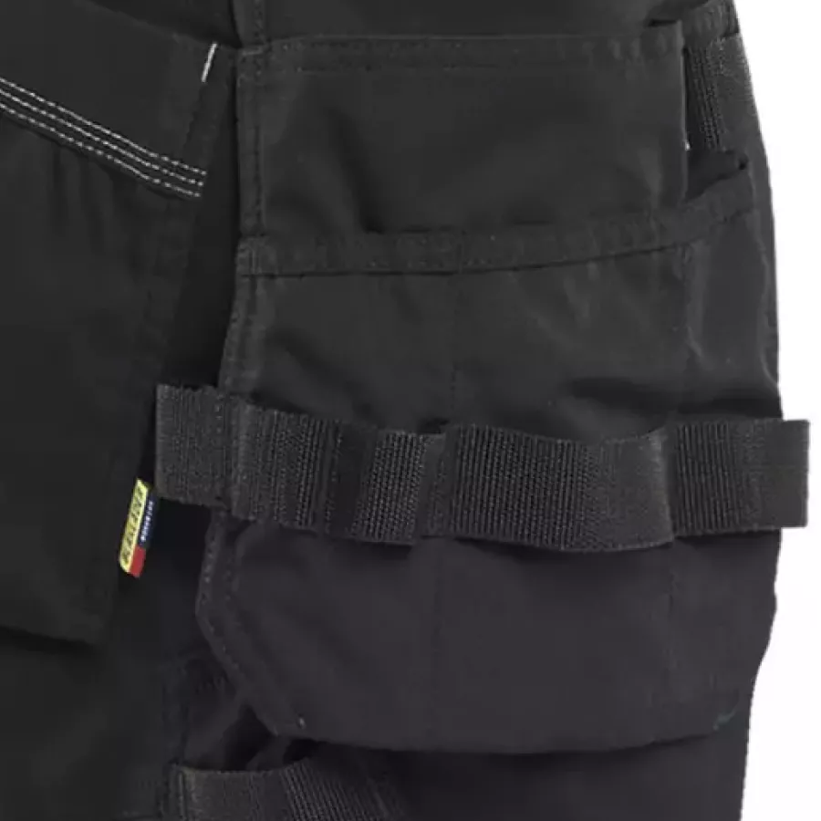**Holster Pockets** keep your essentials close at hand so you can move freely without breaking your flow.