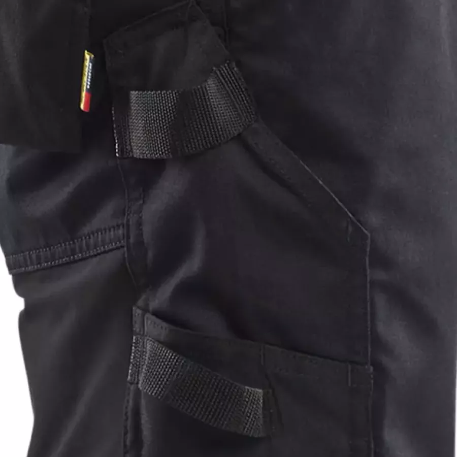 **Reinforced Ruler Pocket with Knife Holder** offers dependable strength for carrying precise tools safely.