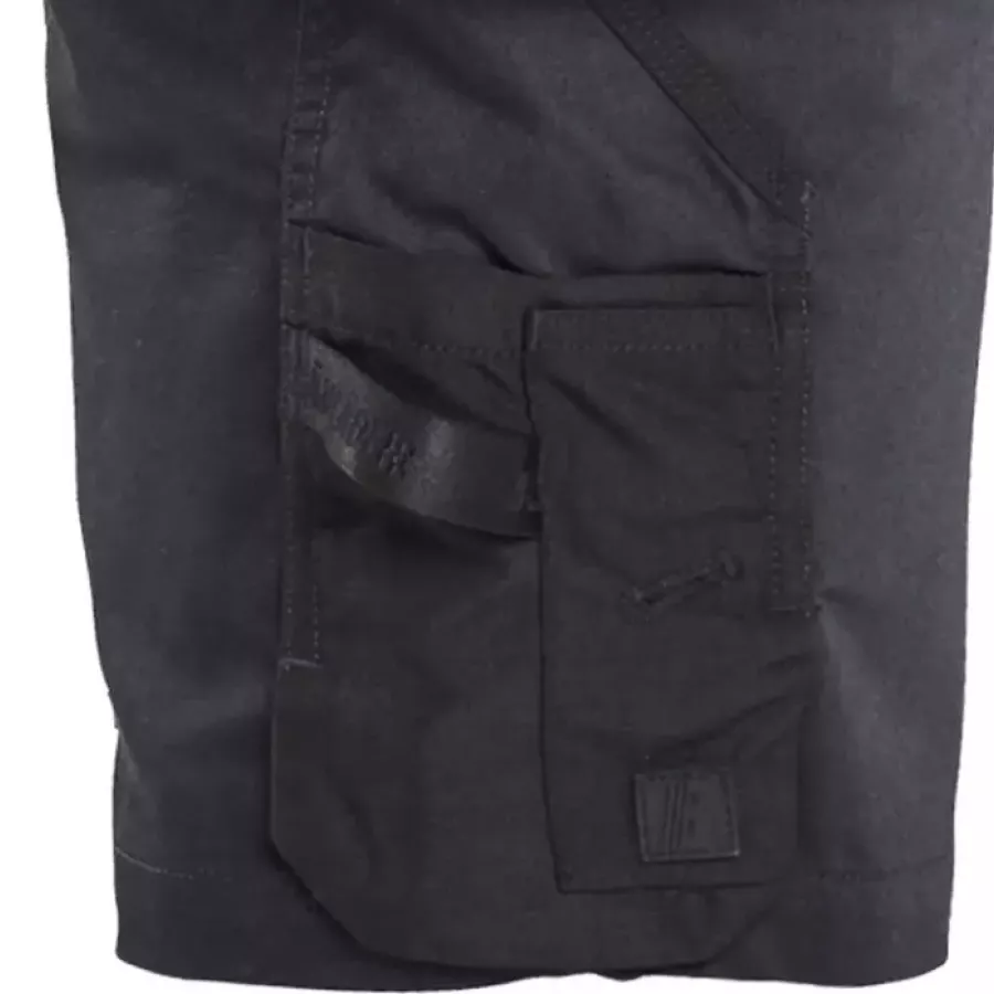 **Reinforced Ruler Pocket with Knife Holder** provides added durability and secure tool placement.