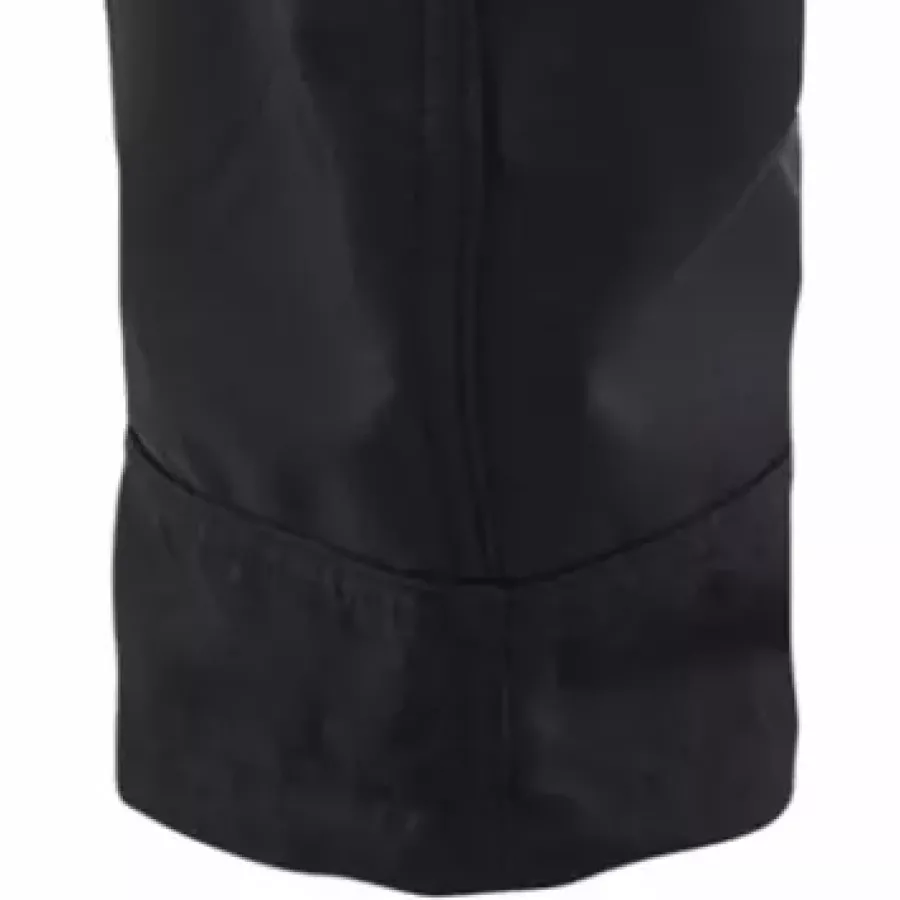 **Verstellbare Beinabschlüsse** ermöglichen eine individuelle Anpassung der Passform für reibungslose Bewegung über Stiefeln und wechselnde Tätigkeiten.