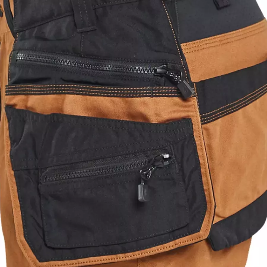 **Removable Tool Pockets** offer customizable storage based on your work needs.