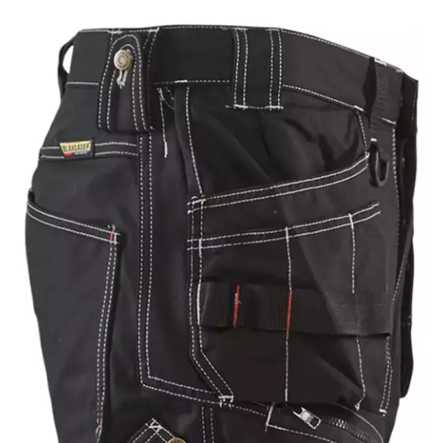 **Reinforced Tool Pockets** keep your essential gear secure and within easy reach all day long.