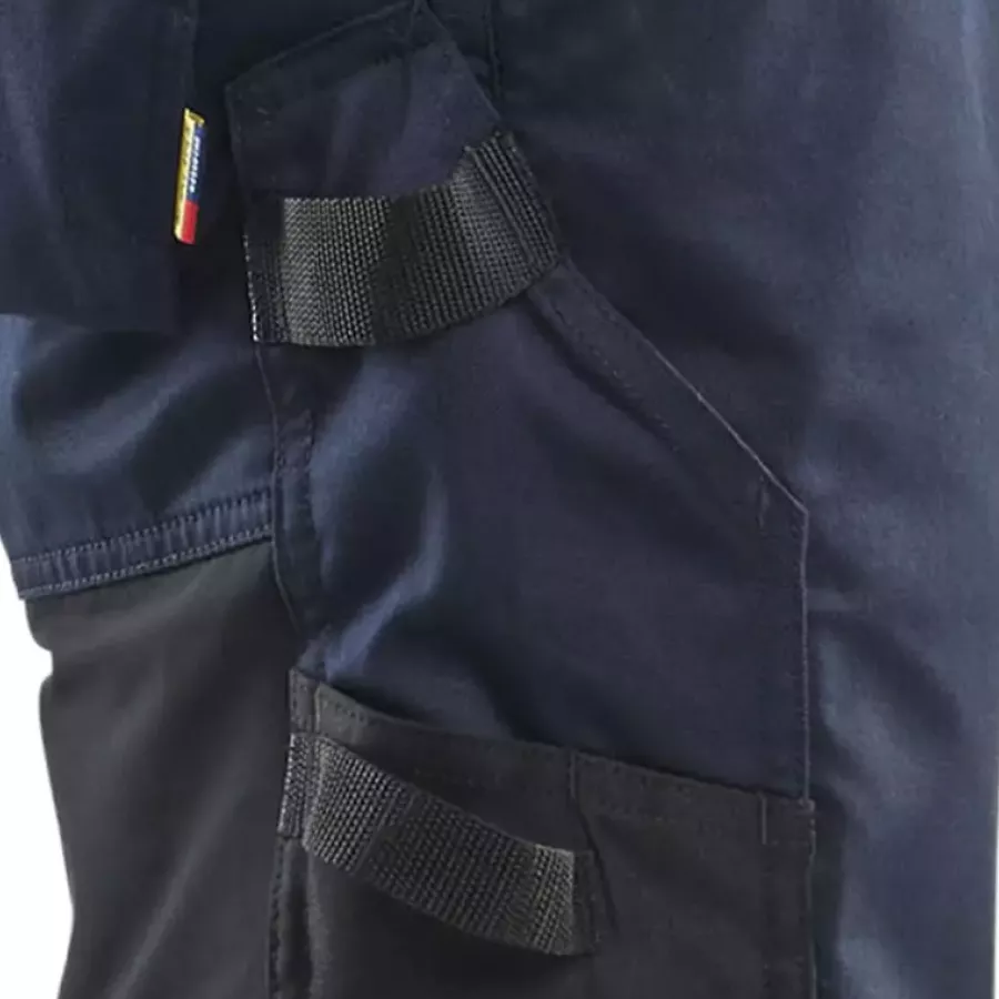 **Reinforced Ruler Pocket with Knife Holder** offers dependable strength for carrying precise tools safely.