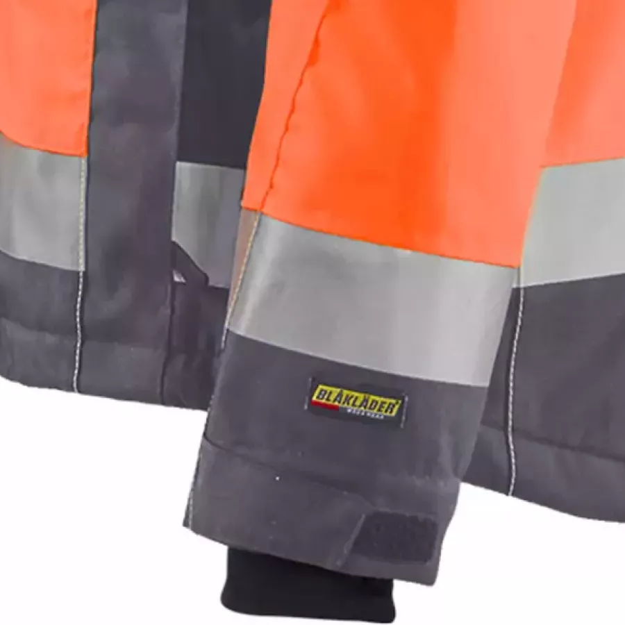 **Adjustable Velcro Cuffs** let you seal out cold and wind for a snug, personalized fit.