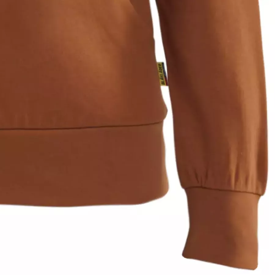 **Ribbed Cuffs** hold sleeves in place for comfort that moves with you.