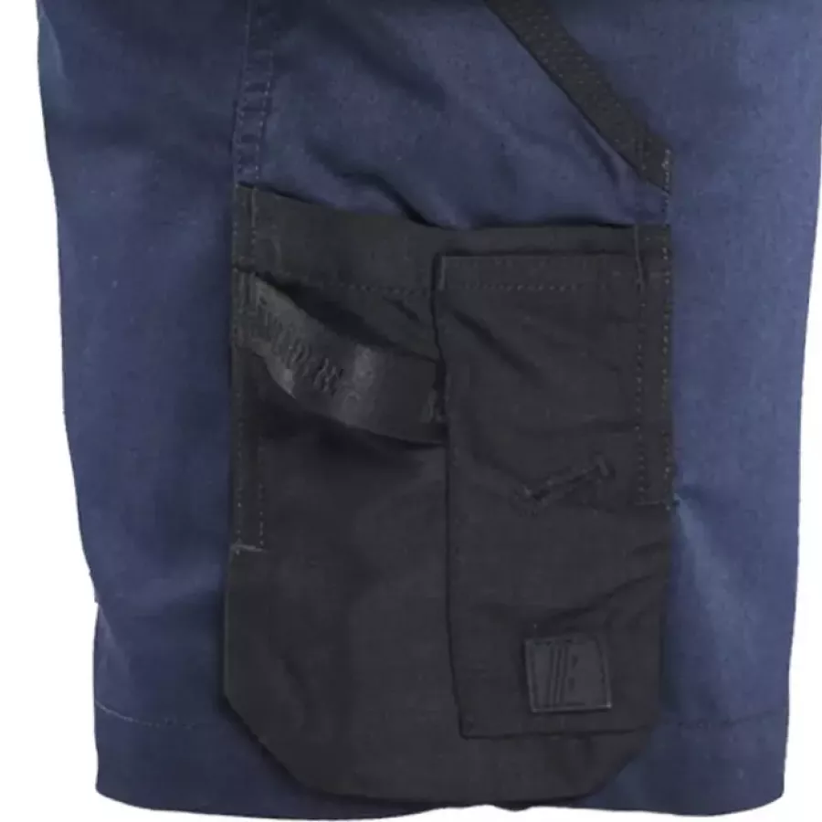 **Reinforced Ruler Pocket with Knife Holder** provides added durability and secure tool placement.