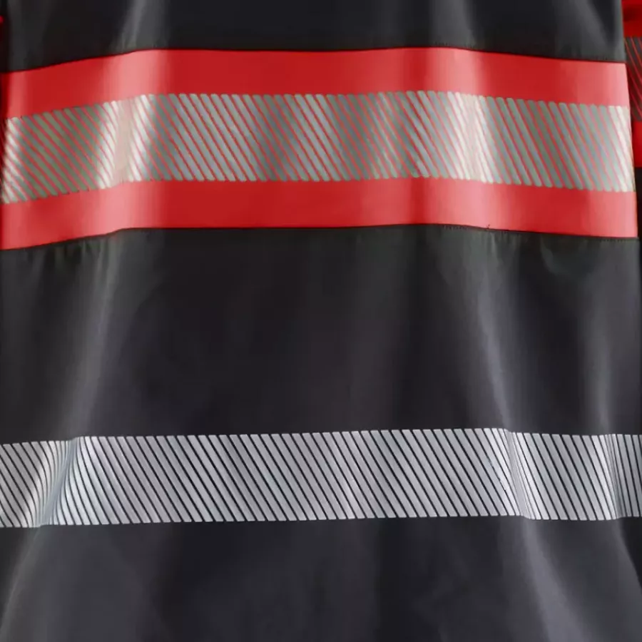 **Segmented Reflective Strips** boost visibility while keeping the jacket flexible and comfortable.