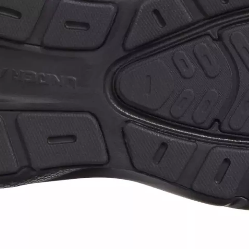 **Slip-resistant outsole tread.** Segmented rubber pods and flex grooves channel grip across every step of your shift.