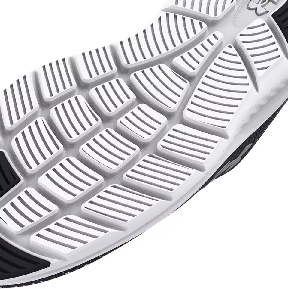 **Slip-resistant outsole tread.** Multi-directional lugs and flex grooves grip the surface firmly to keep you stable through a long shift.