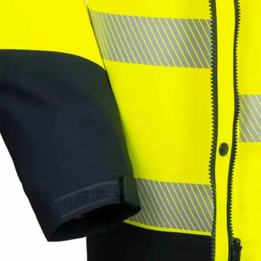 **Verstellbare Bündchen mit Klettverschluss** bieten eine individuelle Passform, die hilft, Wärme und Komfort einzuschließen.